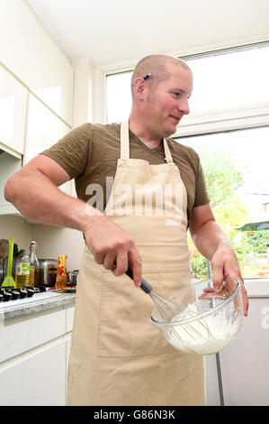 Claire Spreadbury from The Press Association takes part in a 'Bake Off' at the home of Richard Burr who took part in the BBC show 'The Great British Bake Off' in 2014. Stock Photo