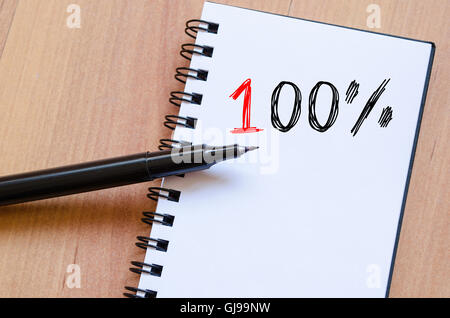 One hundred percent symbol text concept write on notebook Stock Photo