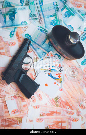 The gun and playing cards Russian big money Stock Photo