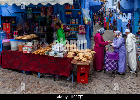 Local Women Buying Food In The Medina, Chefchaouen, Morocco Stock Photo