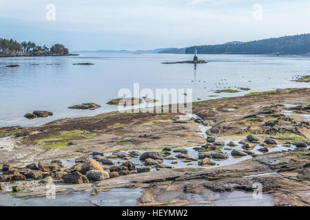 A sunny winter day at a rocky beach on Gabriola Island, in British Columbia's Gulf Islands. Stock Photo