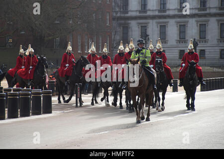 London, UK. 03rd Feb, 2017. Changing The Queen's Life Guard at Horse Guards Parade. The Queen's Life Guard is normally provided by men of the Household Cavalry Mounted Regiment which consists of a Squadron of The Life Guards, who wear red tunics and white plumed helmets, and a Squadron of The Blues and Royals with blue tunics and red plumed helmets. Credit: Alberto Pezzali/Pacific Press/Alamy Live News Stock Photo