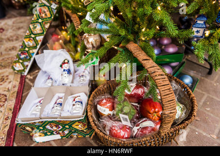 Presents and gifts underneath Christmas tree with many ornaments Stock Photo