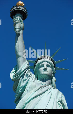 Statue of Liberty in a sunny day, blue sky in New York Stock Photo