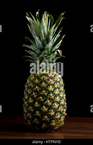 Pineapple on black isolated background Stock Photo