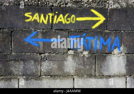 Arrows on the Portuguese Camino de Santiago pilgrimage route. Stock Photo