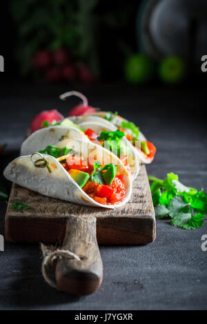 Mexican tacos with avocado, lime and tomato sauce Stock Photo