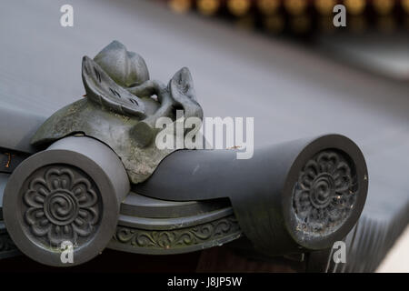 Traditional Japanese architecture and rooftop gargoyles. Stock Photo