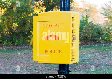 emergency call police yellow box in a New-York city park Stock Photo