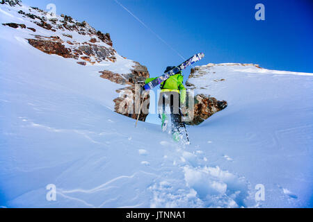 A man hiking up to ski the Hear of Darkness Couloir in the Wasatch Backcountry, Utah Stock Photo