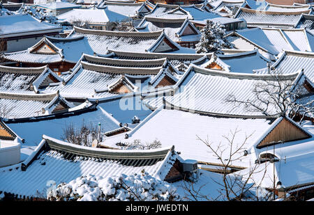 Roof of Jeonju traditional Korean village covered with snow, Jeonju Hanok village in winter, South Korea. Stock Photo