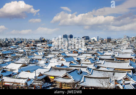 Roof of Jeonju traditional Korean village covered with snow, Jeonju Hanok village in winter, South Korea. Stock Photo