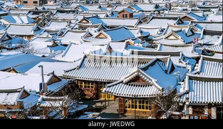 Roof of Jeonju traditional Korean village covered with snow, Jeonju Hanok village in winter, South Korea. Stock Photo