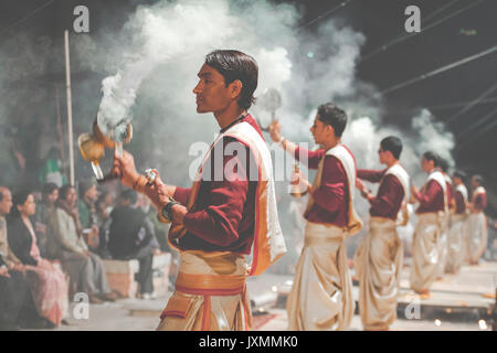 VARANASI, INDIA - JANUARY 25, 2017: Waving Kapoor lamps. Crowds watch as priests perform the Ganga Aarti ceremony at Dasaswamedh Ghat in Varanasi, Ind Stock Photo