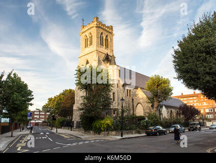 London, England, UK - September 29, 2016: Evening sun illuminates the tower and west face of Holy Trinity With St Barnabas Church on Hartland Road in  Stock Photo