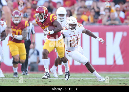 Los Angeles, CA, US, USA. 16th Sep, 2017. September 16, 2017: USC Trojans wide receiver Velus Jones Jr. (23) breaks a tackle attempt by Texas Longhorns linebacker Jeffrey McCulloch (23) in the game between the Texas Longhorns and the USC Trojans, The Los Angeles Memorial Coliseum in Los Angeles, CA. Peter Joneleit/ Zuma Wire Service Credit: Peter Joneleit/ZUMA Wire/Alamy Live News Stock Photo