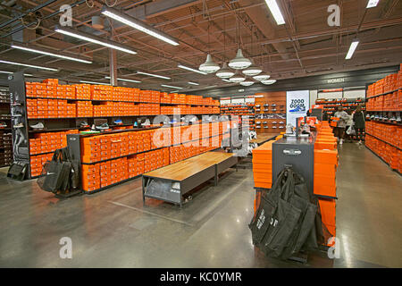 The discount shoe department inside the Nike Factory Store at the Tanger Outlet Mall in Deer Park Long Island, New York. Stock Photo