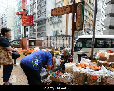 Sheung Wan has many traditional dried fish and seafood products sold in shops or by vendors on the street. Stock Photo