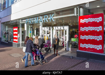 Primark shoppers seeking price reductions, entering and leaving Store; shops, shopping in Hanley, Stoke-on-Trent, UK Stock Photo