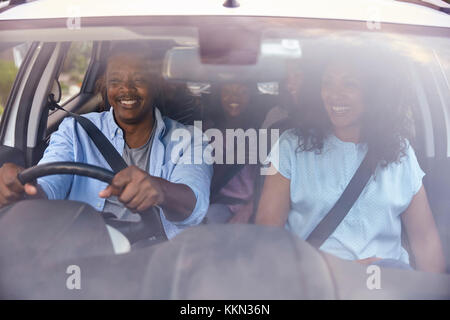 Family With Teenage Children In Car On Road Trip Stock Photo