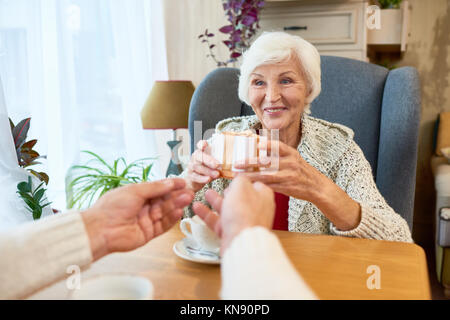 Senior Couple Exchanging Gifts Stock Photo