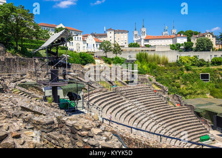 Ruins of Roman Theatre in Lyon, France with the Basilica of Notre-Dame de Fourviere in the background. Stock Photo