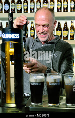 Learning to pour the 'Perfect Pint', The Guinness Academy, Guinness Storehouse, Dublin, Ireland Stock Photo