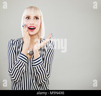 Surprised happy woman with opened mouth. Shocked fashion model woman Stock Photo