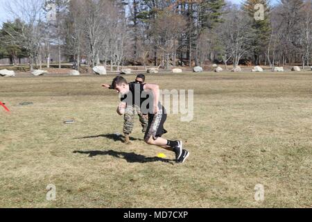 U.S. Marine Corps Staff Sgt. Carlos Arroyo with Recruiting Station Springfield, Mass., Recruiting Substation Swansea, instructs a Marine Corps pool program member during a pool program function at Lincoln Woods State Park in Lincoln, Rhode Island, March 10, 2018. (U.S. Marine Corps photo by Sgt. Connor Hancock) Stock Photo