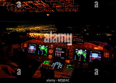 Flight deck of a Boeing 747-400 overhead NYC (in the background) Stock Photo