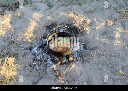 Vegetable stew being cooked in a camp oven while bush camping, Far North Queensland, FNQ, QLD, Australia Stock Photo