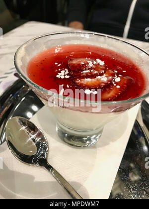 Strawberry Panna Cotta in Glass Cup Served at Restaurant. Dessert Concept. Stock Photo