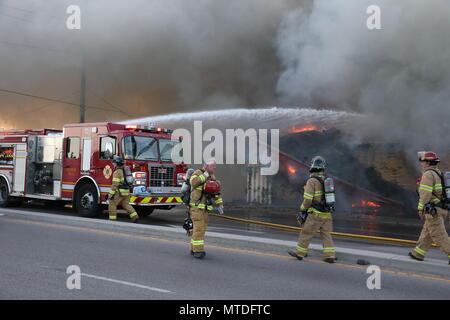 London Ontario, Canada. May 29th 2018, London, Ontario Canada, Fire broke out at the old Hooks restaurant around 5:15pm today at the corner of Southdale and Wharncliffe in London Ontario,  Fire crews were battling the flames for hours and had the blaze tame round 8 pm.  Even though the restaurant has not been open years, Londoners still have great memories and are sad to let this building go. Luke Durda/alamy Live news. Stock Photo