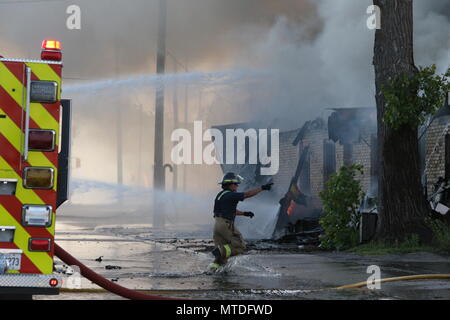 London Ontario, Canada. May 29th 2018, London, Ontario Canada, Fire broke out at the old Hooks restaurant around 5:15pm today at the corner of Southdale and Wharncliffe in London Ontario,  Fire crews were battling the flames for hours and had the blaze tame round 8 pm.  Even though the restaurant has not been open years, Londoners still have great memories and are sad to let this building go. Luke Durda/alamy Live news. Stock Photo