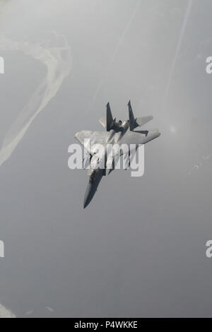 EIELSON AIR FORCE BASE, Alaska – A U.S. Air Force F-15C Eagle pilot assigned to the 67th Fighter Squadron out of Kadena Air Base, Japan, performs a sortie May 9, 2017, during NORTHERN EDGE 2017 (NE17), over the Joint Pacific-Alaska Range Complex. NE17 is Alaska’s premier joint training exercise designed to practice operations, techniques and procedures as well as enhance interoperability among the services. Thousands of participants from all the services, Airmen, Soldiers, Sailors, Marines and Coast Guardsmen from active duty, Reserve and National Guard units are involved. Stock Photo