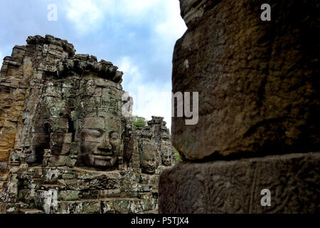 Smiling faces of the Bayon Temple in Siem Reap, Cambodia. Built in the late 12th or early 13th century by King Jayavarman VII. Stock Photo