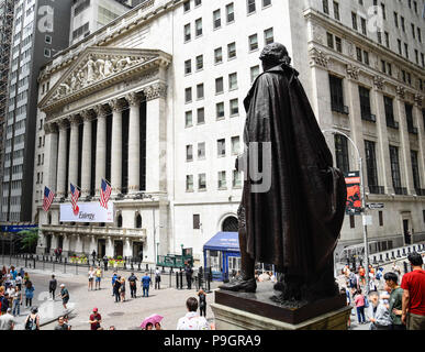 New York City, USA - June 20, 2018: Rear view of George Washington statue in Federal Hall against New York Stock Exchange building in Wall Street in F Stock Photo