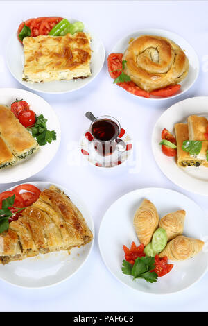 Homemade rolled borek, pastry, Turkish patty with tea Stock Photo