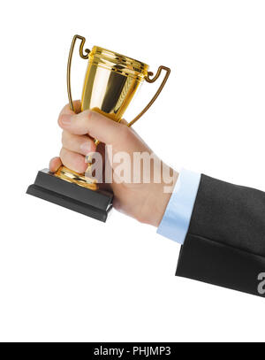 Golden trophy cup in hand Stock Photo