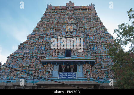 The eastern Gopuram, or gateway tower, of the Meenakshi temple complex covering 45 acres in the heart of Madurai in Tamil Nadu state, India Stock Photo