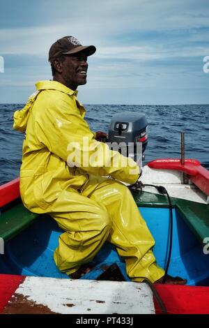 Vila do Maio ,Maio Island, Cape Verde - Jan 5 2016: local fisherman going out to sea to fish for yellow fin tuna or wahoo in a traditional colorful di Stock Photo