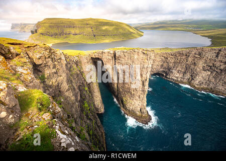 Sorvagsvatn or Leitisvatn infinity lake above the Ocean, Faroe Islands Stock Photo