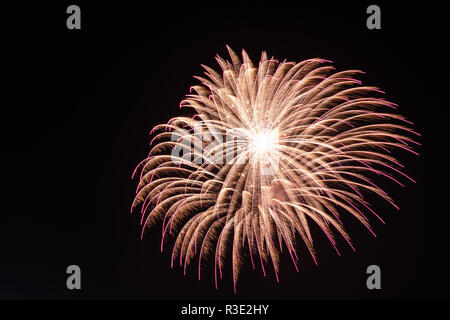 Gold, vilot and white color Fire Works During Feast during the feast of xewkija. st jhon the baptist. isolated on a black background sky at night. Mal Stock Photo