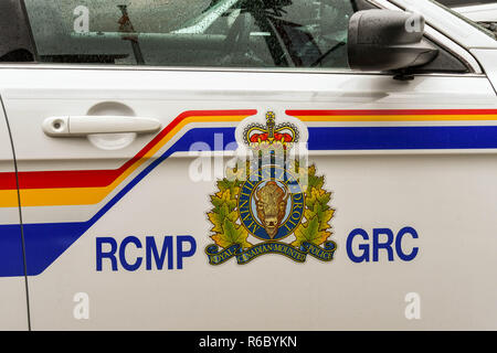 BANFF, ALBERTA, CANADA - MAY 2018: Close up view of the badge on the side of a Royal Canadian Mounted Police patrol car in Banff. Stock Photo