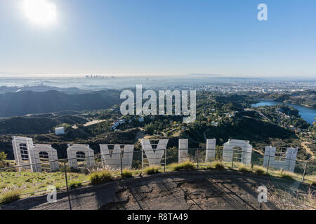 Los Angeles, California, USA - December 13, 2018:  Sunny morning cityscape view from behind the Hollywood sign in popular Griffith Park. Stock Photo