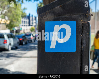 Parking symbol pasted on a parking machine for street parking in city Stock Photo