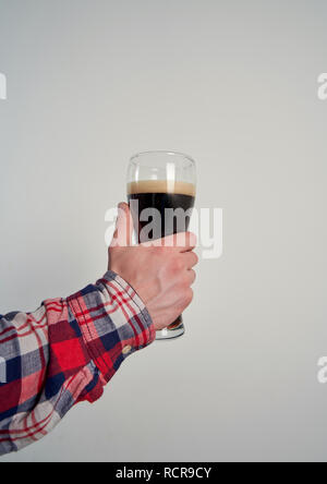 beer mug in hand on white background Stock Photo