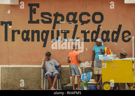 Cape Verde, Maio Island: street scene in the town of Vila di Maio (Porto Ingles), peddler and inscription 'Espaco tranquilidade', peaceful area Stock Photo