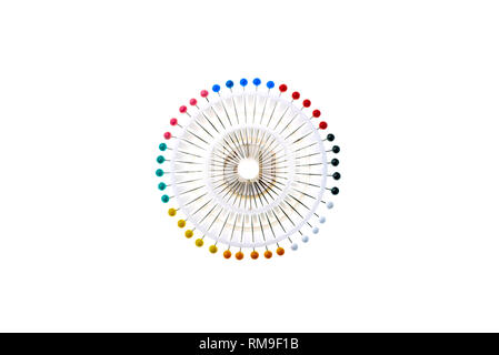 Set of colourful round headed or berry pins,  in a white plastic holder forming an abstract image. Stock Photo