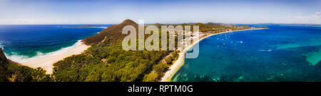 Aerial panorama over TOmaree mountain from Zenith beach to distant Nelson bay town in Port Stephens area of Australia on Pacific coast. Stock Photo